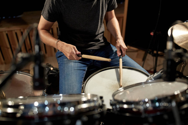 man playing drums at concert or music studio - Фото, изображение