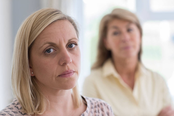 Mature Mother Concerned About Adult Daughter At Home - Photo, image