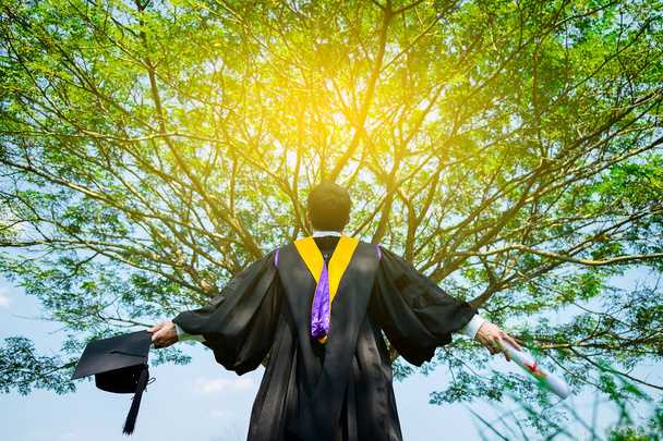 successful graduating student with nature background. - Foto, imagen
