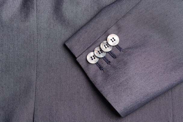 Four buttons on a grey business jacket sleeve - Photo, Image