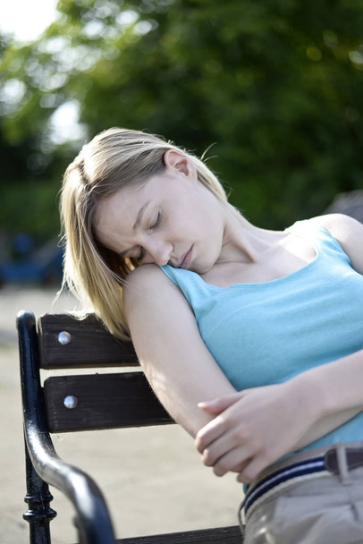 woman sleeping on bench - Photo, Image