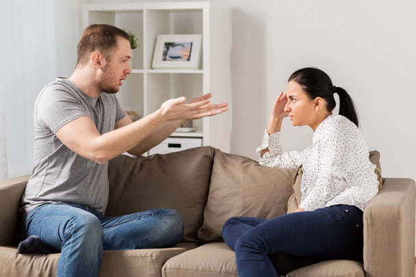 unhappy couple having argument at home - Foto, imagen