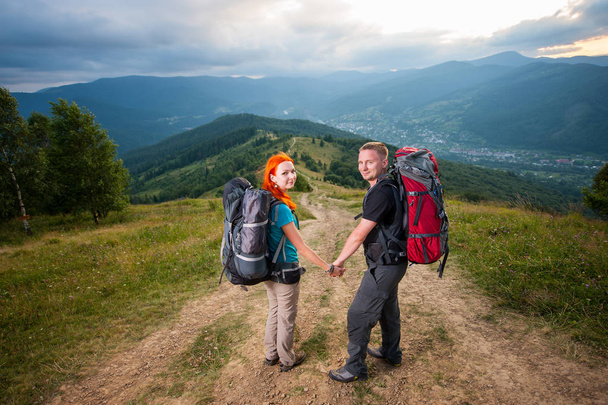 couple hikers in mountains - Photo, Image