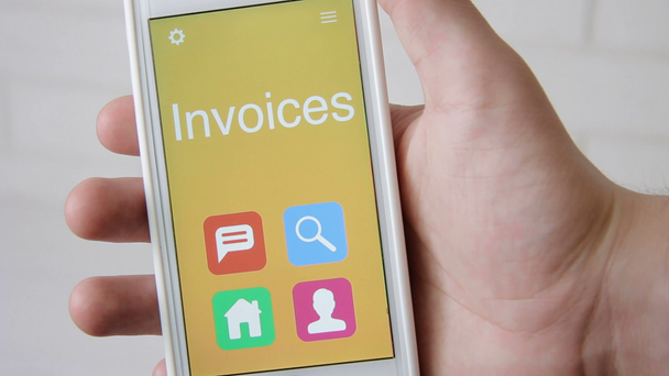 Invoices concept application on the smartphone. Man uses mobile app. - Footage, Video