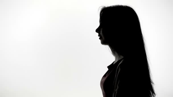 Young woman showing forward in profile - Imágenes, Vídeo