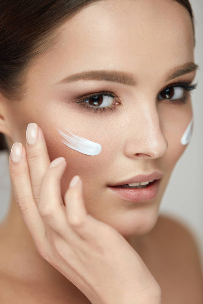 Woman Beauty Face Care. Portrait Of Female With Facial Cream - Photo, Image