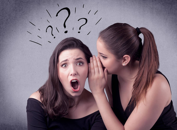 girl telling secret things to her girlfriend - Foto, immagini