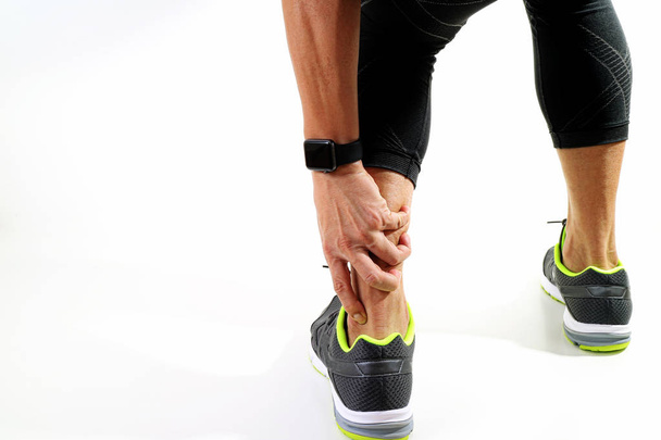 Runner sportsman holding ankle in pain with Broken twisted joint - Photo, Image