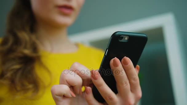 woman in sweater using phone - Materiał filmowy, wideo