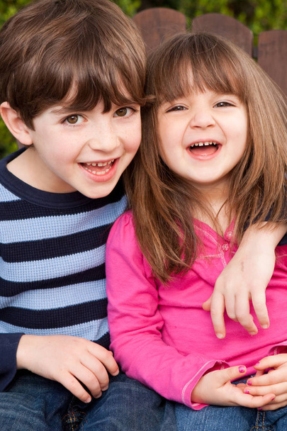 Brother and sister smiling and laughing. - Photo, Image