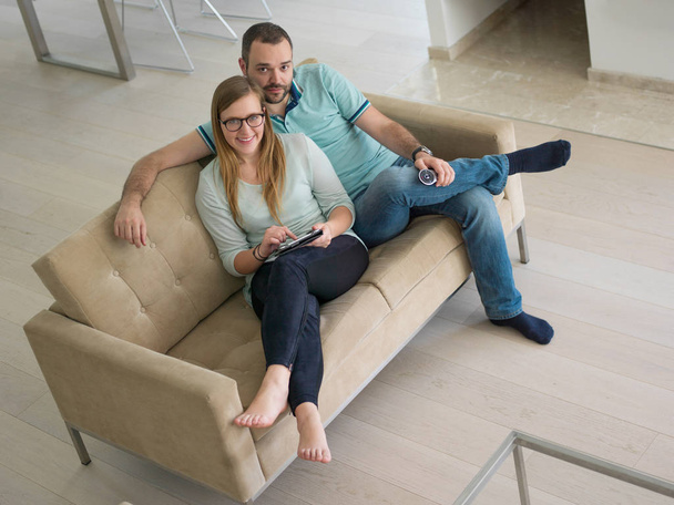 couple relaxes in the living room - Foto, Imagem