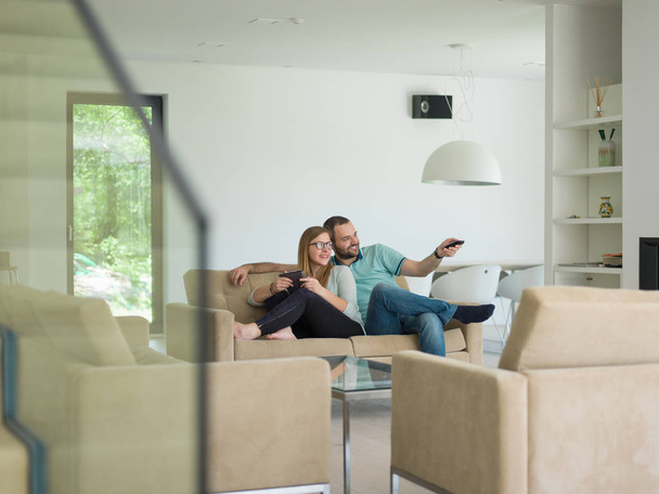 couple relaxes in the living room - Foto, imagen