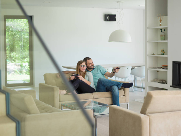 couple relaxes in the living room - Photo, Image