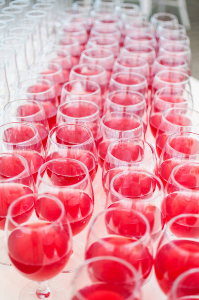 catering services. glasses with wine in row background at restaurant party - Photo, Image