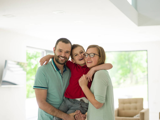 family with little boy enjoys in the modern living room - Foto, Imagen