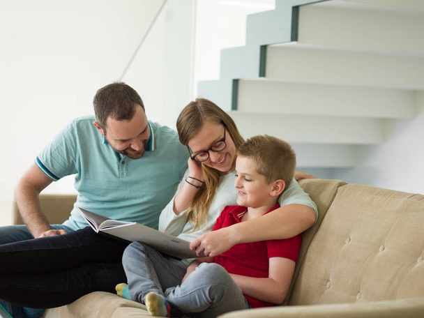family with little boy enjoys in the modern living room - Φωτογραφία, εικόνα