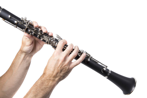Mies soittaa klarinettia
 - Valokuva, kuva