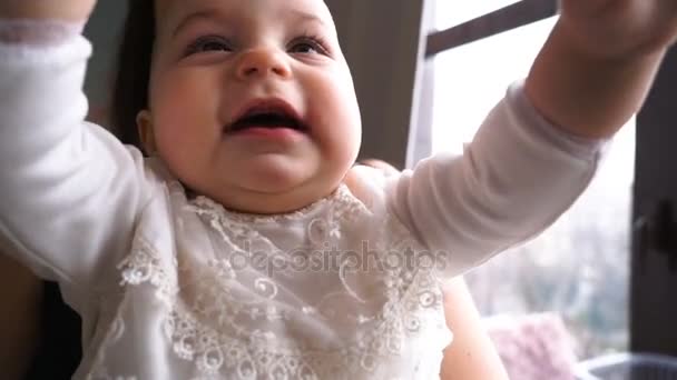 Mother and Baby smiling together. cheerful family Mom and Baby girl at home. - Imágenes, Vídeo