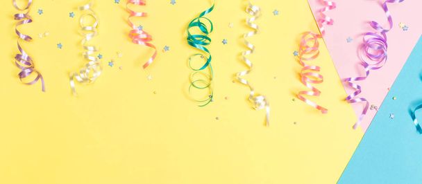 Party streamers on a bright background - Foto, Imagem