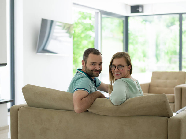 Rear view of couple watching television - Фото, изображение