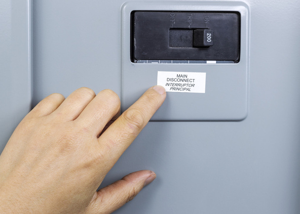 Finger pointing to main circuit breaker - Photo, Image
