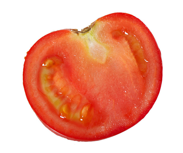上面白い背景に分離されたトマトの一部. - 写真・画像