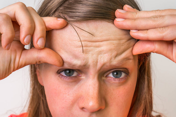 Woman with wrinkles on forehead - Photo, Image