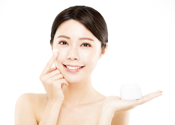 young woman showing  beauty product on hand - Photo, image