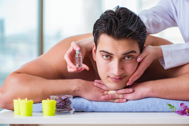 Handsome man in spa massage concept - Photo, Image