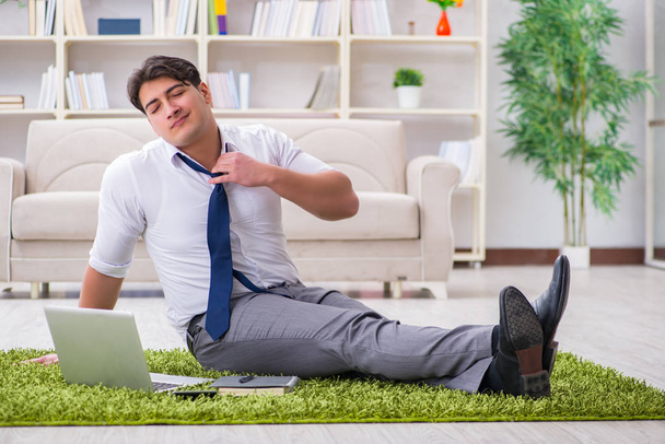 Businessman sitting on the floor in office - Photo, Image