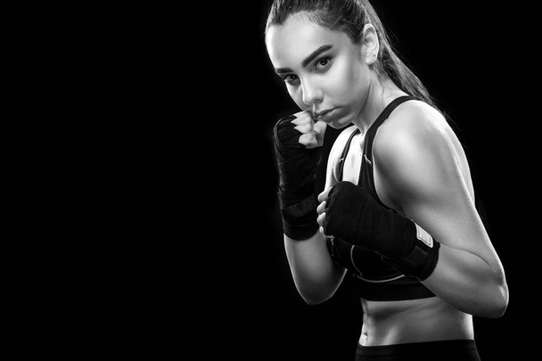 Sportsman muay thai boxer fighting. Isolated on black background. Copy Space. Sport concept. - Valokuva, kuva