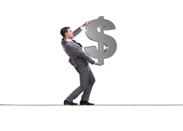 Businessman walking tightrope with dollar sign - Фото, изображение