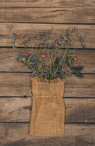 Dry flowers in sack bag - Foto, Imagen