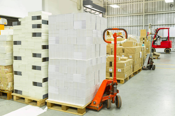 Interior of a warehouse with manual forklift pallet stacker truc - Photo, Image