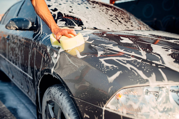 young man washing car - Photo, Image