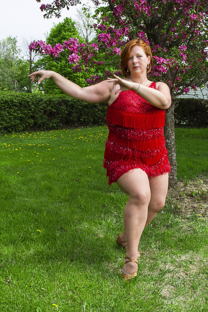 Woman dancing outside - Фото, изображение