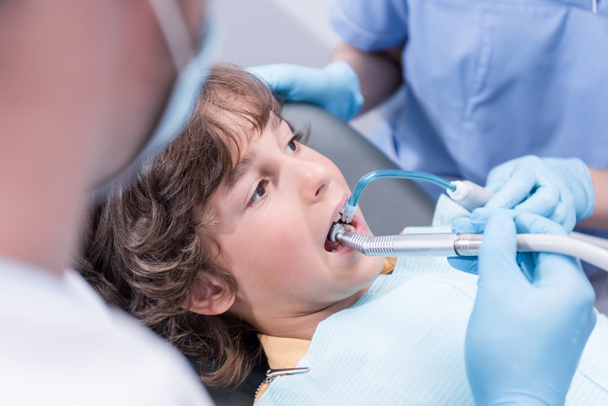 dentists treating patients teeth - Fotó, kép
