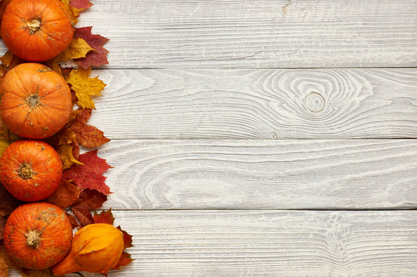 Wooden planks with autumn leaves  - Photo, image