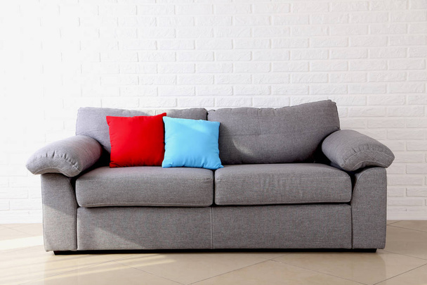 Colorful pillows on grey sofa  - Zdjęcie, obraz