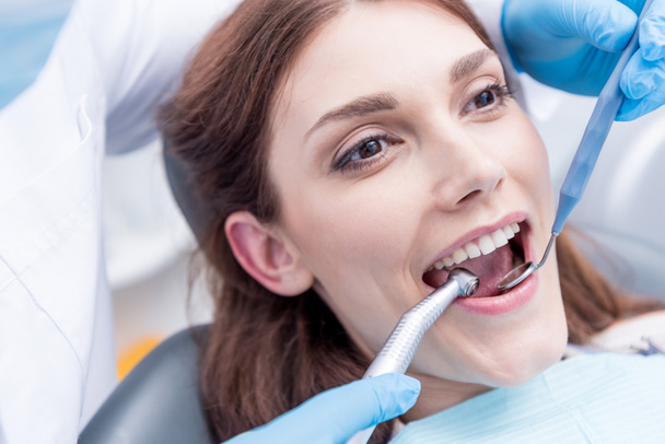 dentist curing patients teeth - Fotoğraf, Görsel