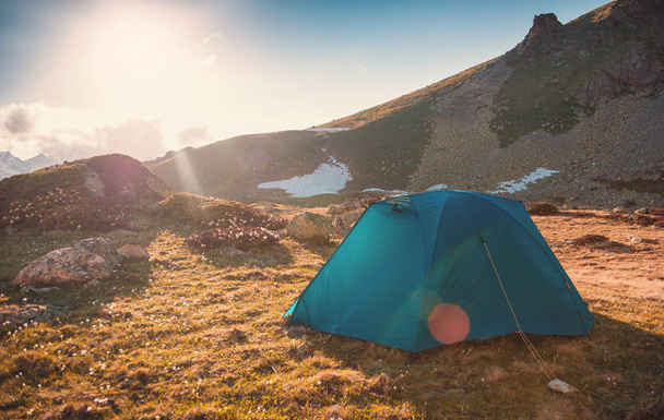 Tourist tent in camp among mountain landscape - Foto, Imagen