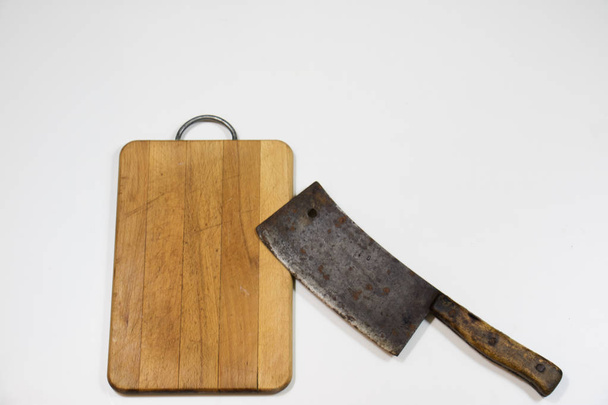 Old chopper and plank on white background, tools for butcher - Foto, imagen