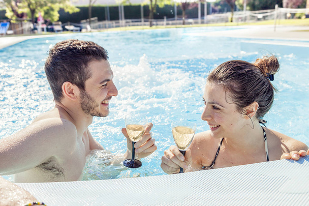 Young loving couple relaxes and drink wine - Photo, Image