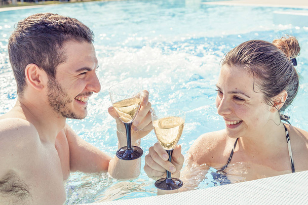 Young loving couple relaxes and drink wine - Foto, Imagem