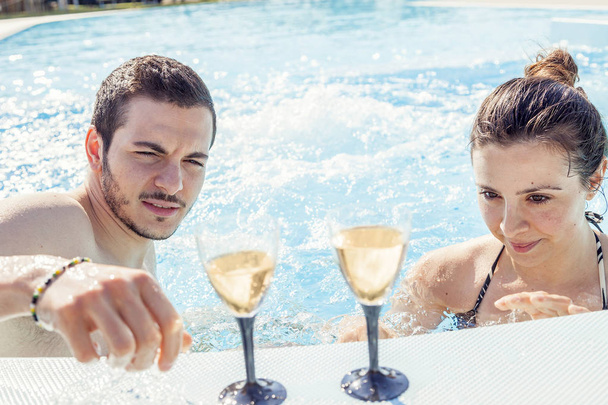 Young loving couple relaxes and drink wine - Photo, Image