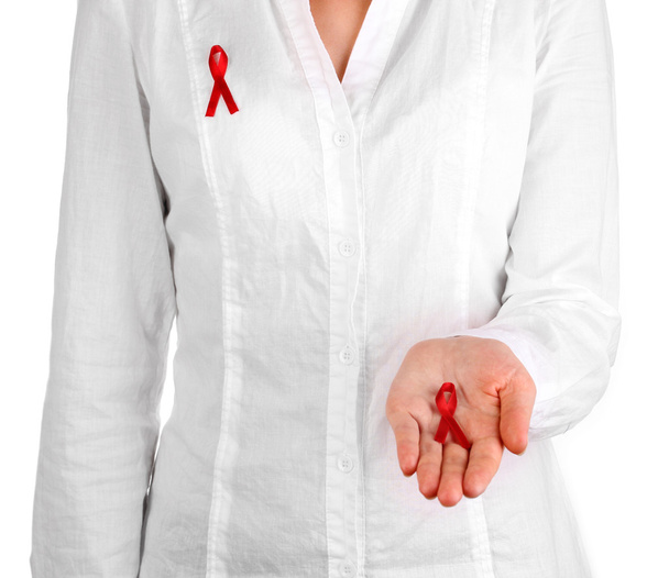 Woman with red ribbon in hands on isolated on white - Fotoğraf, Görsel