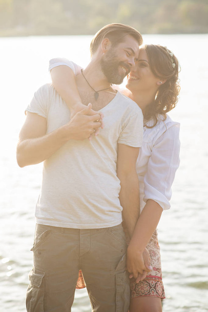 couple hugging near lake - Fotó, kép