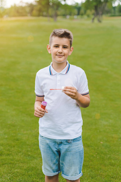 Boy playing with soap bubbles - Foto, imagen