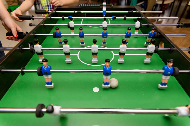 People playing in table football - Zdjęcie, obraz