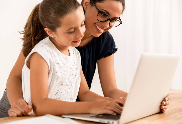 Mom teaching Daughter working with laptop  - Fotografie, Obrázek
